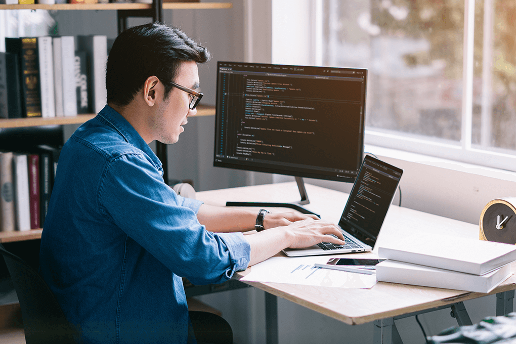 Male programmer working diligently