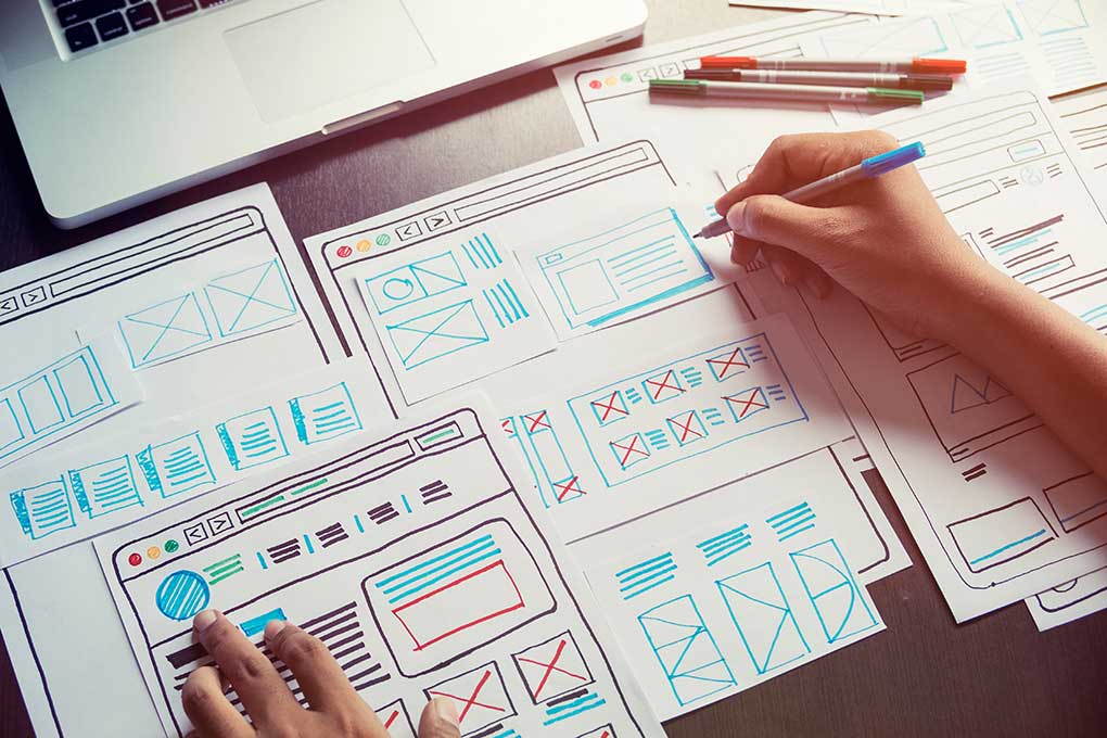 Website designer planning wireframes