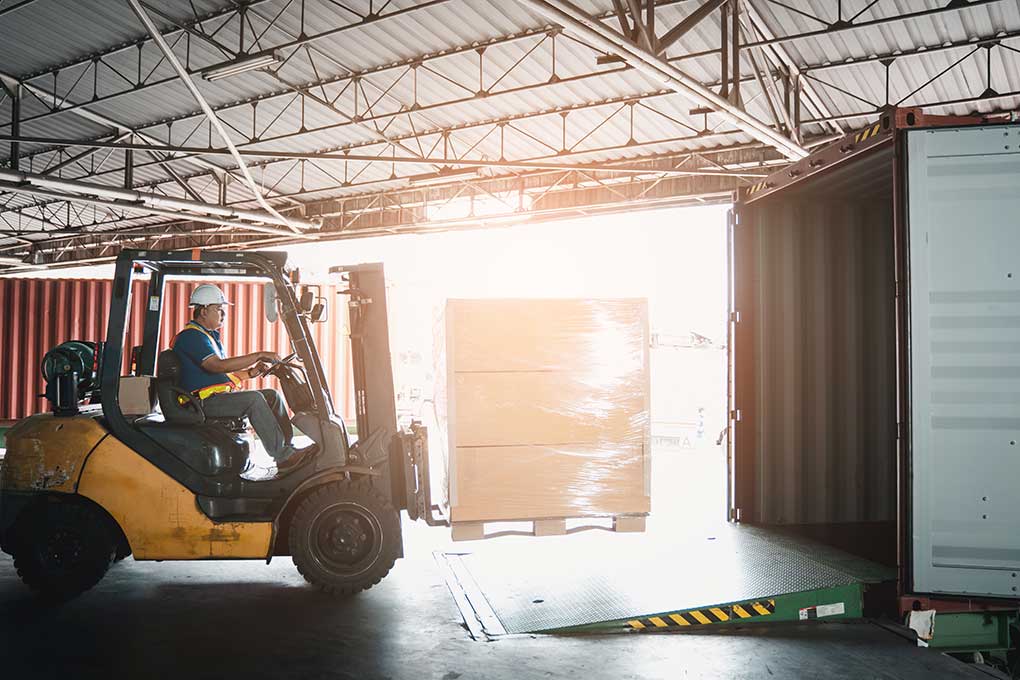 Warehouse worker using a forklift